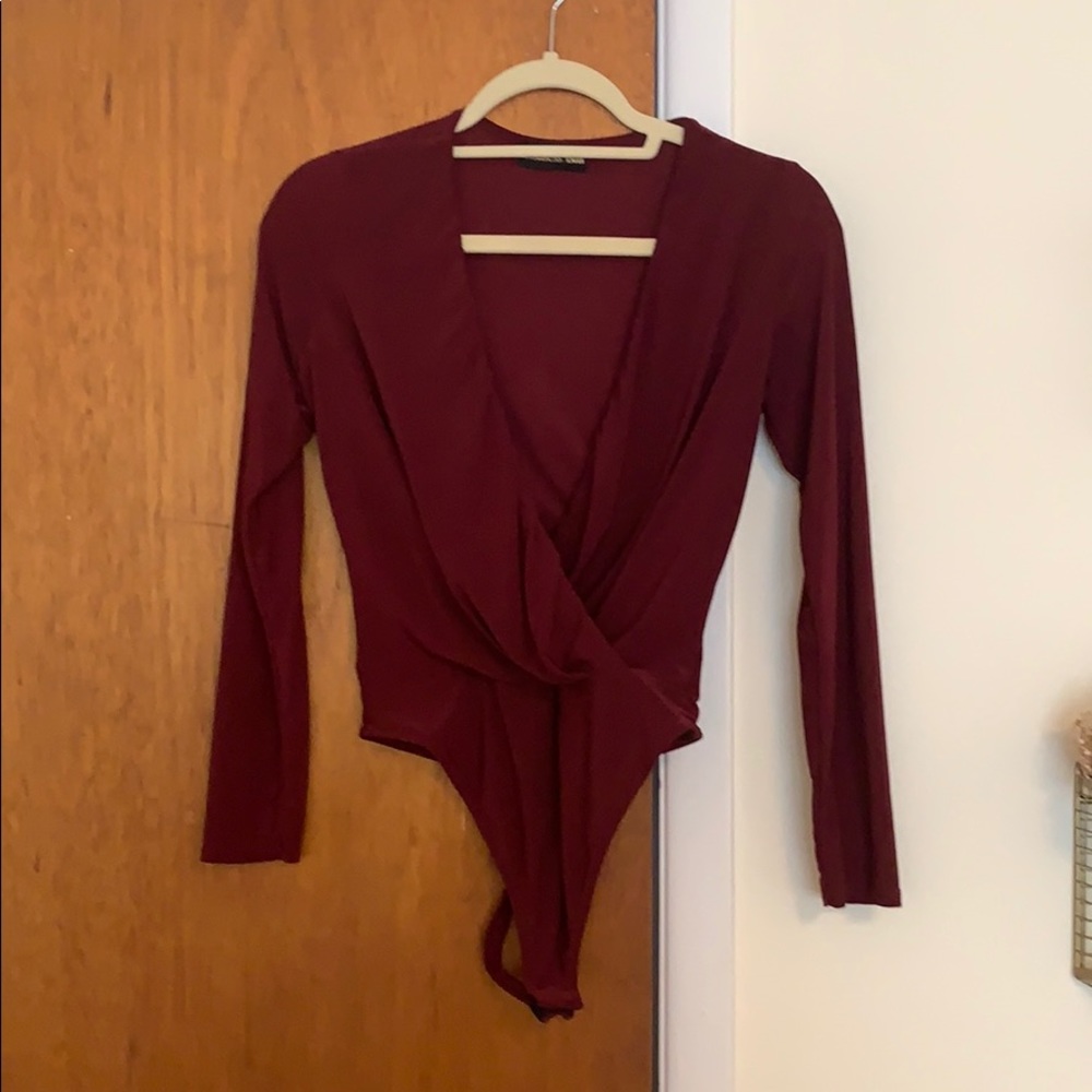 Red long sleeve bodysuit.